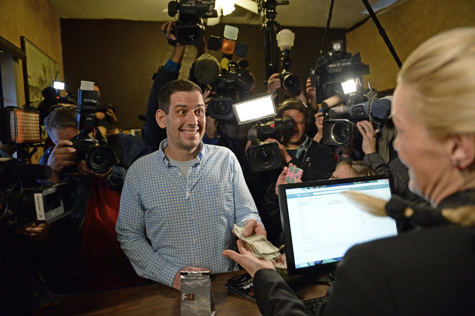 Looking back at the first month of legal recreational marijuana sales in Colroado, the look on Sean Azzariti's face says it all. (Azzariti is an Iraq war veteran who suffers from post-traumatic stress disorder and made the first purchase of recreational marijuana at 3D Cannabis Center on Jan. 1.)