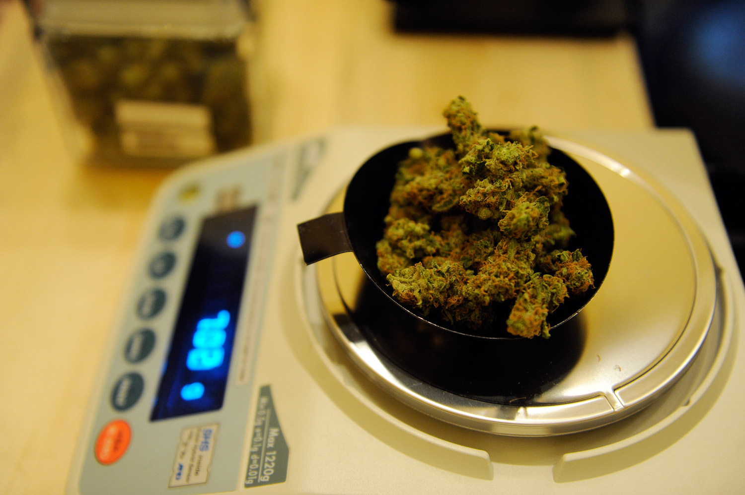 Marijuana weighed on scale