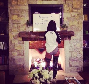 Rihanna by fireplace