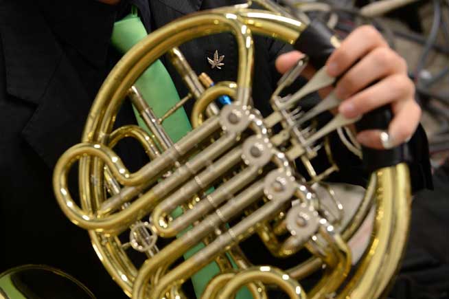Musician Kolio Plachkov practiced on his French horn before the Colorado Symphony Orchestra's Classically Cannabis private fundraising event at the Space Gallery on May 23. (Karl Gehring, The Denver Post)