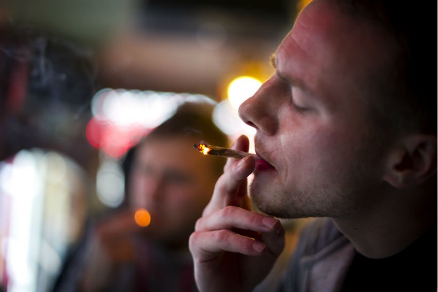 A British man smokes marijuana in an Amsterdam coffee shop. (Jasper Juinen, Getty)