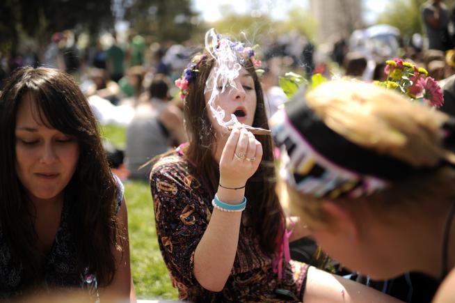 Malia Knapp celebrates the Denver 420 Rally with her friends at Civic Center in April 2012. (Hyoung Chang, The Denver Post)