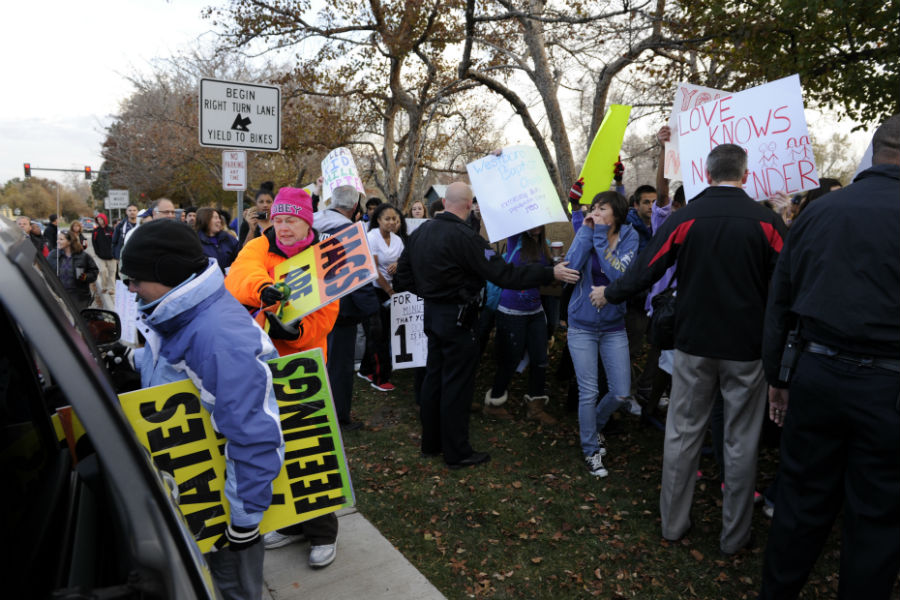 Members of the controversial Westboro Baptist Church protested outside Denver's East High School in November 2011. (RJ Sangosti, The Denver Post)
