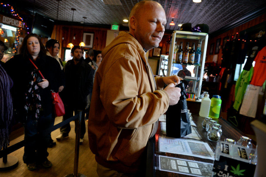 Jack Randall of Little Rock, Ark., visits La Conte's Clone Bar & Dispensary during a My 420 Tours marijuana tour in Denver, Colo. in December 2014. (Craig F. Walker, The Denver Post)
