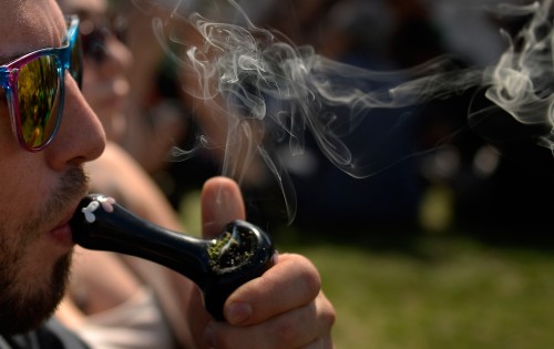 A man smokes at a recent 420 rally in Denver's Civic Center Park. (Joe Amon, Denver Post file) 