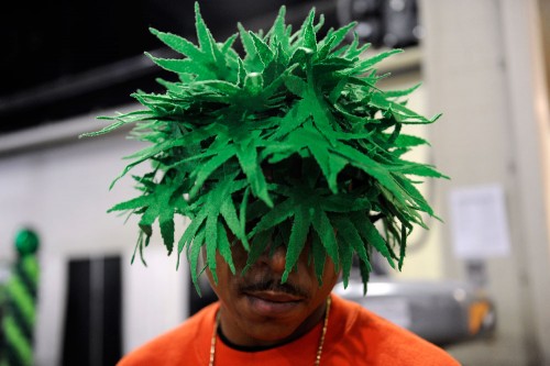 A man attending the High Times Cannabis Cup sports a marijuana leaf hat at the Denver Mart on April 20, 2014. (Seth McConnell, Denver Post file)