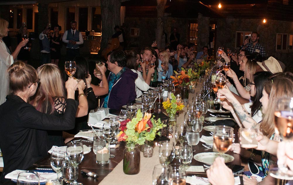 Guests raise their glasses during a toast at the Headquarters Harvest Dinner. (Lisa Siciliano, Dog Daze Photo)