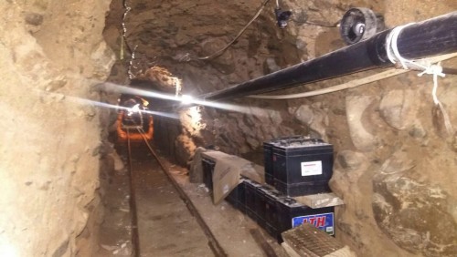 A light shines in an 2,600 foot-long ventilated and rail-equipped underground tunnel that police say was built to smuggle drugs from Tijuana, Mexico into California in this Oct. 21, 2015 photo released by Mexico's Federal Police.  (Mexico Federal Police via The Associated Press)