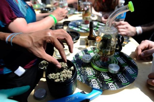 Marijuana samples are divvied up at The Green Solution booth during the High Times Cannabis Cup at the Denver Mart on April 20, 2014.