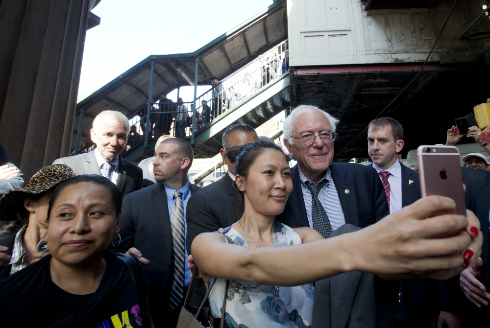 Democratic presidential candidate Bernie Sanders, I-Vt., poses for a photo while walking in the Jackson Heights neighborhood of the Queens borough of New York on April 18, 2016. (Mary Altaffer, AP)