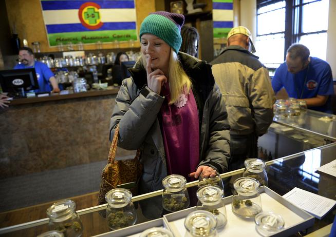 Colorado marijuana shop customer looks at products