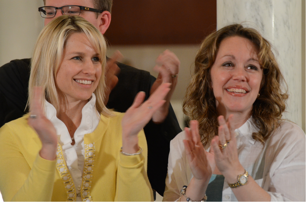 Christine Brann, of Hummelstown, and Angela Sharrer, of New Oxford, applaud lawmakers in the Pennsylvania Capitol after the state House of Representatives voted to send medical marijuana legislation to Gov. Tom Wolf's desk on April 13, 2016, in Harrisburg, Pa. Brann and Sharrer each have a child who suffers from a severe form of epilepsy that they believe can be helped by a marijuana oil extract that is legal in some other states. (Marc Levy, AP)