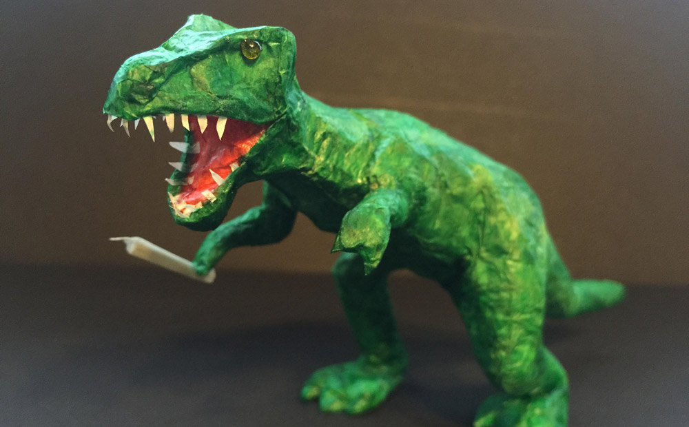 Artistic joint rolling: Tony Greenhand dinosaur with doobie
