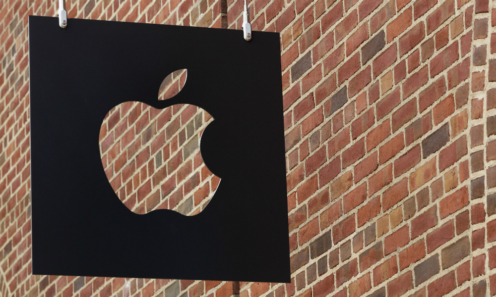 The Apple logo hangs in front of a new Apple Store in July 2016 in Brooklyn's Williamsburg neighborhood in New York. (Mark Lennihan, AP)