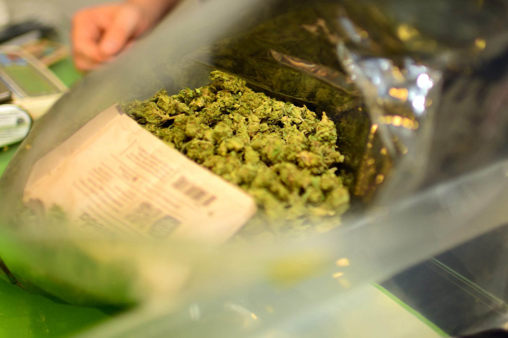 Pounds of cured marijuana are prepped before being packaged for sale at the Outliers Collective in San Diego County, California in October 2016. (Vince Chandler, The Cannabist)