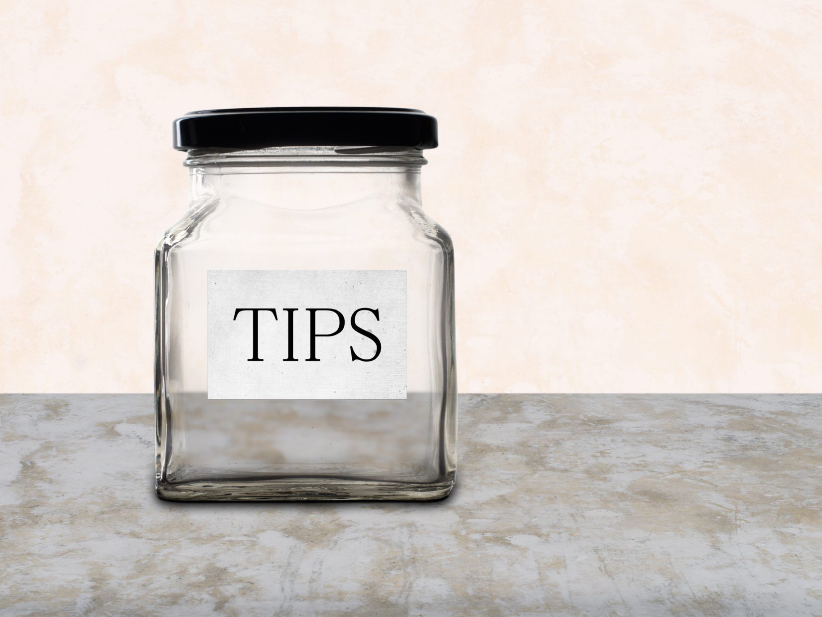 Empty tips jar on counter. No money.