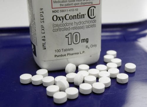 This Feb. 19, 2013, file photo, shows OxyContin pills arranged for a photo at a pharmacy in Montpelier, Vt. (Associated Press file)